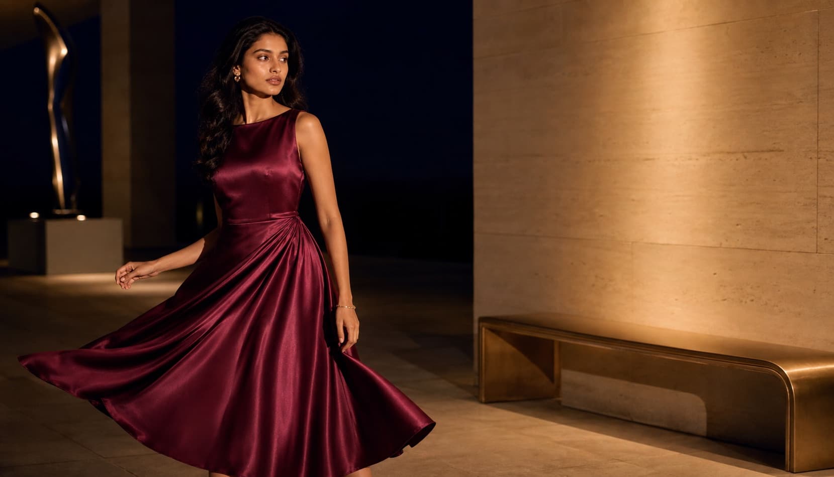 South Asian model in a burgundy satin dress after dark
